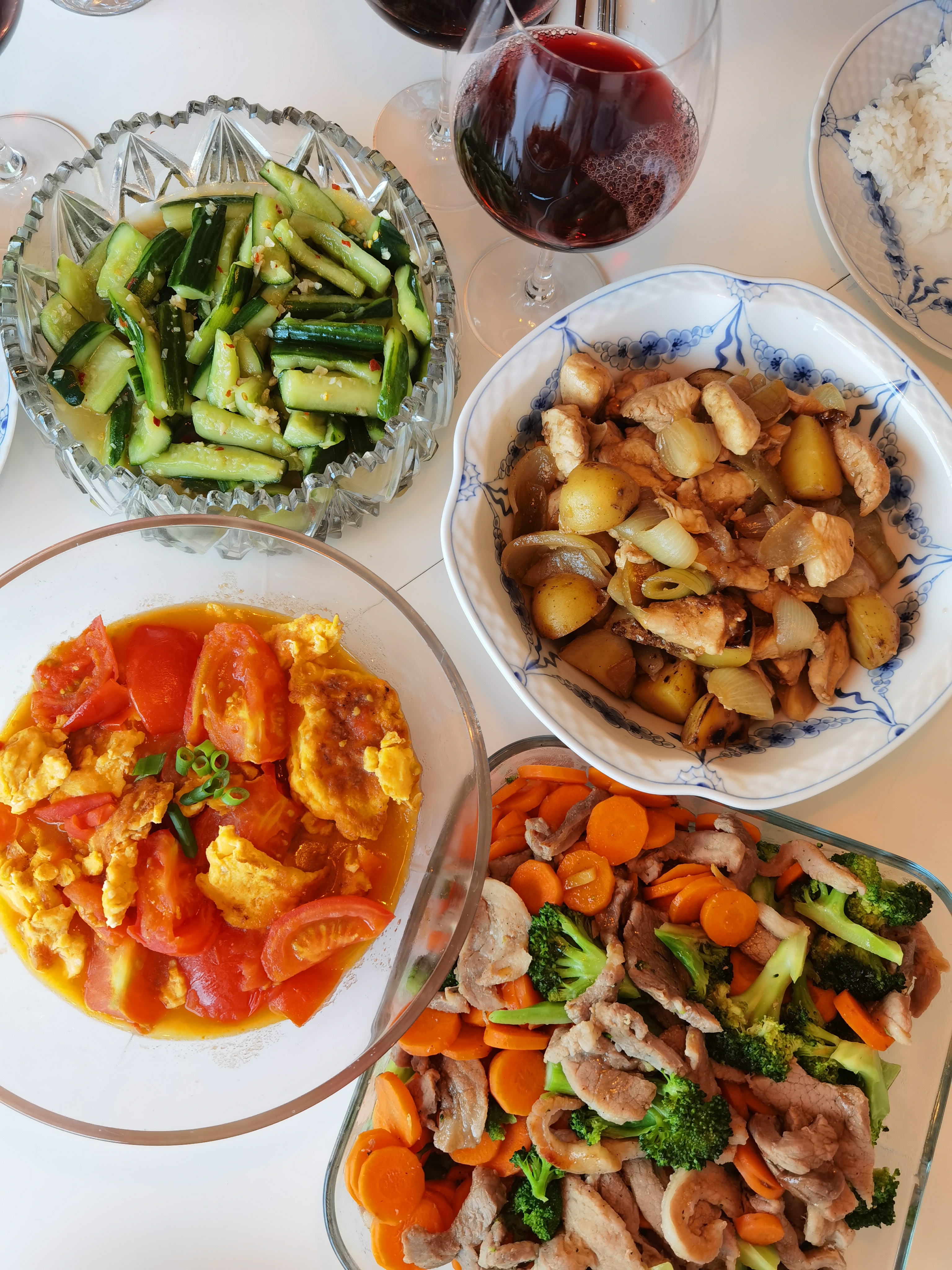 TL: pickled cucumbers/ TR: potato, chicken, onion stew/ BL: stir fried eggs with tomatoes/ BR: marinated pork stir fried with broccoli and carrots
